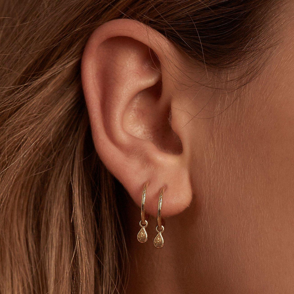 By Charlotte  Gold Grace Hoop Earrings available at Rose St Trading Co