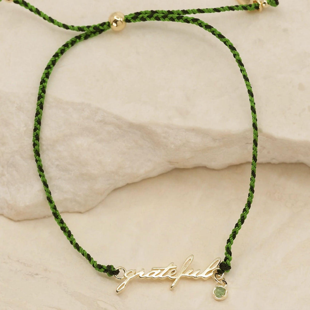 By Charlotte  Gold Grateful Cord Bracelet available at Rose St Trading Co